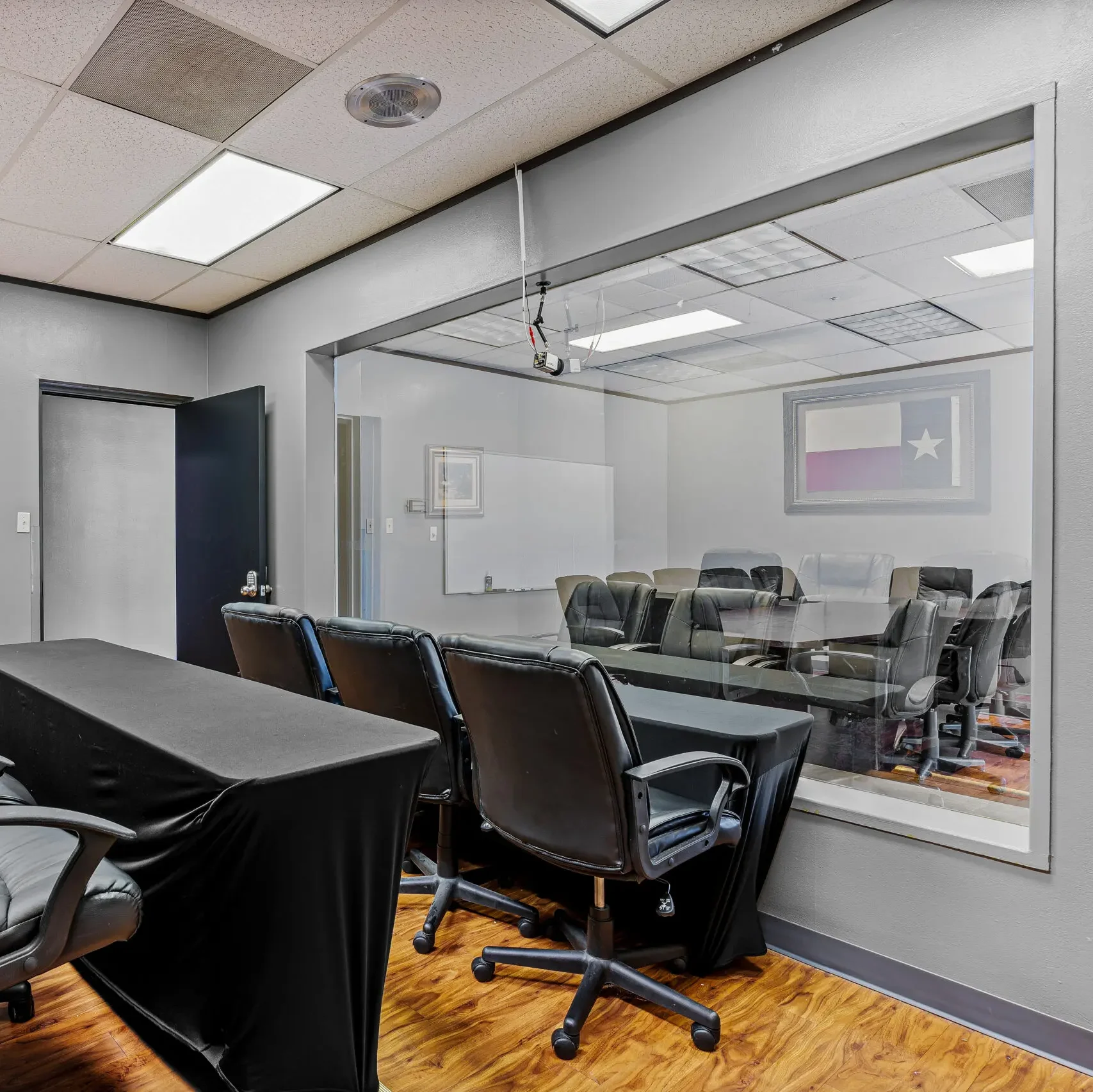 1:1 Mirror room with chairs looking into the research room